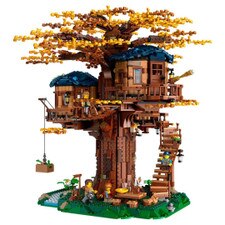 LEGO Ideas Tree House 21318 set fully built with detailed tree canopy, wooden-style house, and minifigures on a display platform