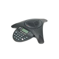 A photo of a Polycom SoundStation 2 conference phone with a circular shape, three microphones, a speakerphone, and an LCD display.