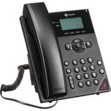 A photo of a Polycom VVX 150 IP Phone on a desk with a headset and a laptop.