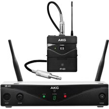 A photo of an AKG WMS420 Wireless Microphone System with a handheld transmitter, a bodypack transmitter, and a stationary receiver