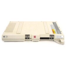 A photo of a gray-colored Avaya Partner 400EC Expansion Module with four green LED lights, a power switch, and a power cord.