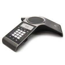 A photo of Yealink CP920 Conference IP Phone, which is a round device with a touch-sensitive keypad and a speaker in the center. The phone supports wireless voice over IP and connects to other device